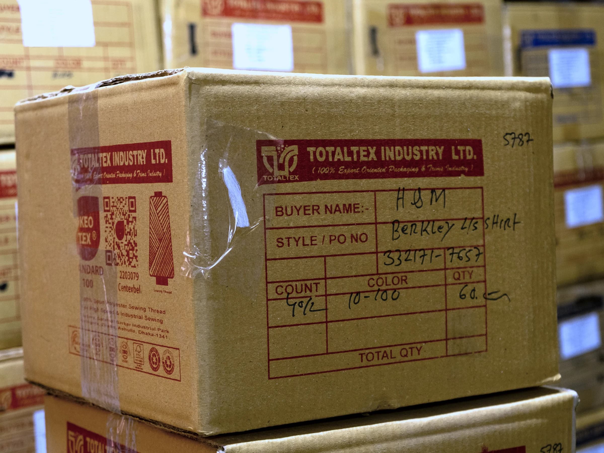 A printed TotalTex export carton carrying the OEKO-TEX mark and a buyer order reference