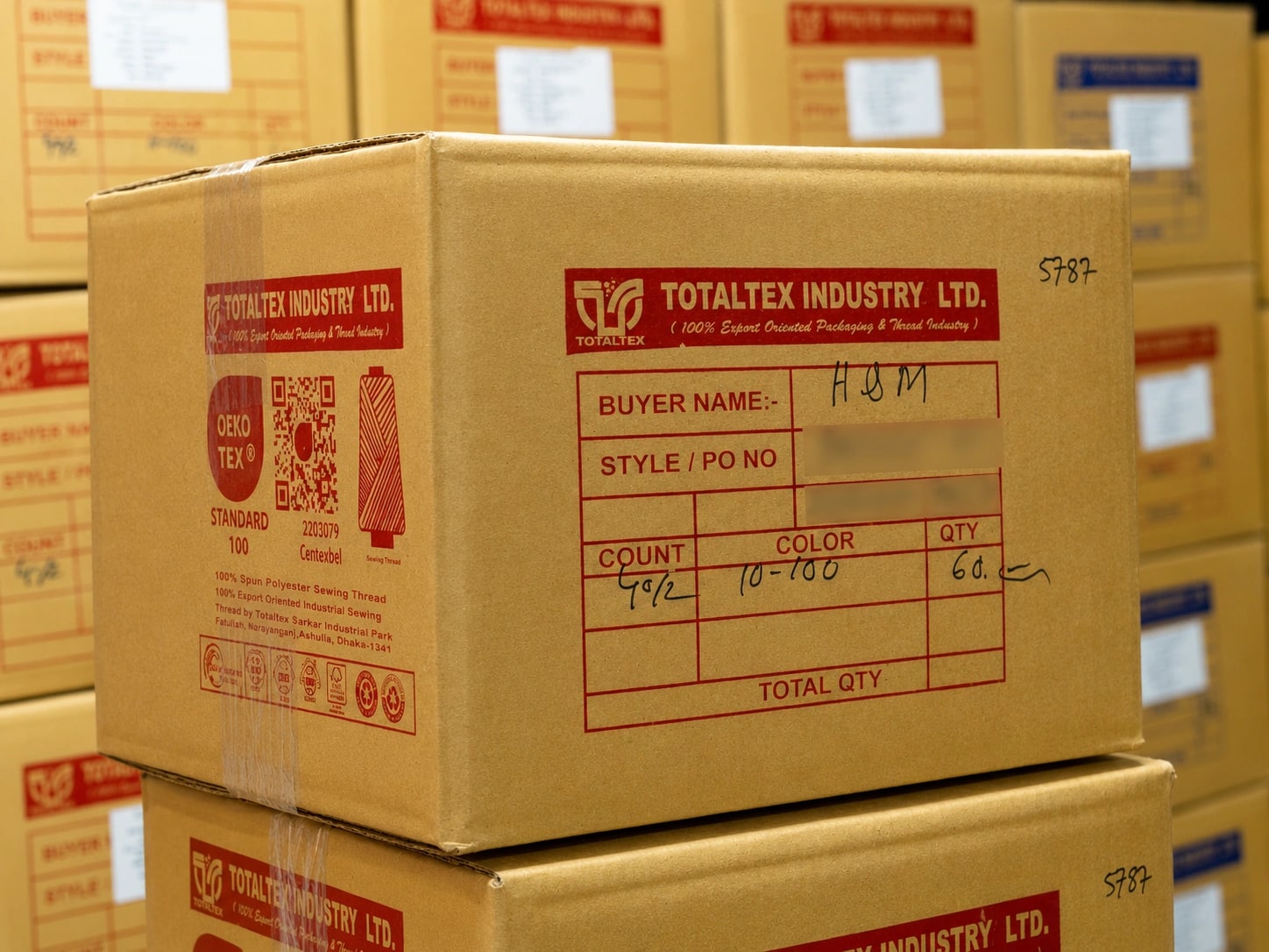 A printed TotalTex export carton carrying the OEKO-TEX mark and a buyer order reference
