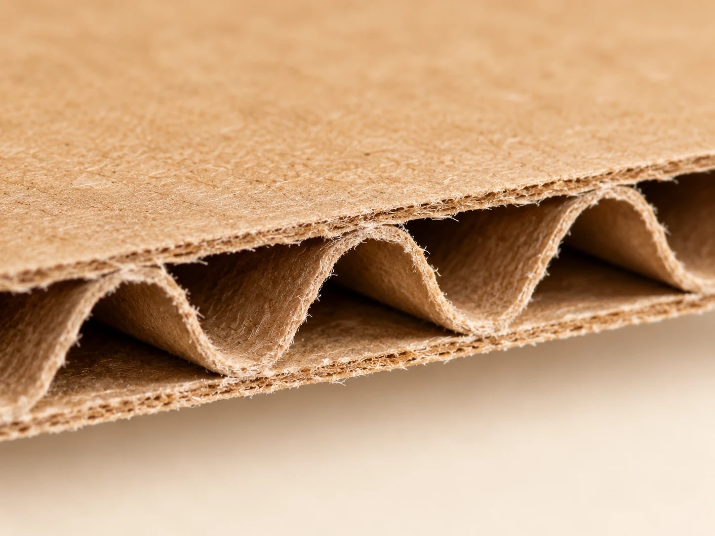 Close view of corrugated kraft board showing the fluted edge